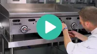 Thumbnail image of a man lighting the pilot of an RX900 Series Griddle using a grill lighter with a play video icon overlaid